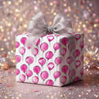 Pink balloon print birthday wrapping paper with silver ribbon.