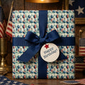 Patriotic red, white, and blue balloon birthday wrapping paper with a navy ribbon by Wrapped Studios.