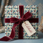 Vintage balloon birthday wrapping paper with a luxury burgundy velvet bow by Wrapped Studios.