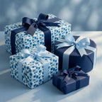 Blue floral wrapping paper and luxury navy gift wrap with elegant ribbon bows by Wrapped Studios.