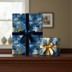 Two gifts wrapped in modern blue wrapping paper with gold accents, adorned with velvet and satin ribbon.