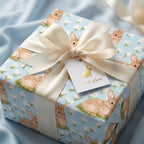 Cute bunny wrapping paper for baby shower or Easter, with a cream bow and gift tag by Wrapped Studios.