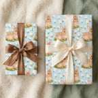 Cute bunny wrapping paper with satin bows on gift boxes, perfect for Easter or baby showers by Wrapped Studios.