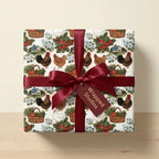 Rustic farmhouse chicken wrapping paper with a red satin bow by Wrapped Studios.