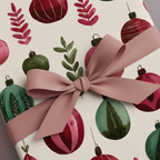 Christmas wrapping paper with red and green watercolor ornaments and pink ribbon bow, ideal for festive holiday gift wrap.