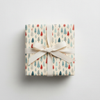 Festive Christmas wrapping paper with a playful red, blue, and green pine tree pattern, tied with a cream ribbon on a white background.