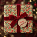 Elegant Christmas gift wrap: watercolor botanical pattern with red berries & leaves, deep red velvet bow, Merry Christmas tag.