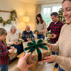 Wrapped Studios: Elegant Christmas gift wrap with botanical holly pattern and luxurious green velvet bow for family gifts.
