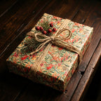 Vintage botanical holiday gift wrap with red berries, green leaves, twine bow & pine sprig on a dark wooden table.