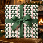 Luxury pink and green Christmas tree wrapping paper with a green ribbon by Wrapped Studios.