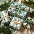 Sage green snowman Christmas wrapping paper with luxury velvet ribbons by Wrapped Studios.