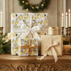 Elegant Christmas gift wrap featuring a yellow ornament floral pattern with white and gold ribbons.