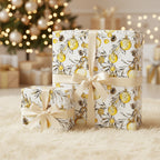 Elegant Christmas gift boxes wrapped in white floral wrapping paper with gold ornament pattern and satin ribbons.