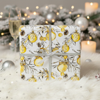 Elegant Christmas gift wrap with gold ornament pattern and silver ribbon on a faux fur backdrop.