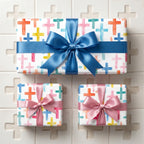 Watercolor cross wrapping paper with satin bows for baptism and christening gifts by Wrapped Studios.