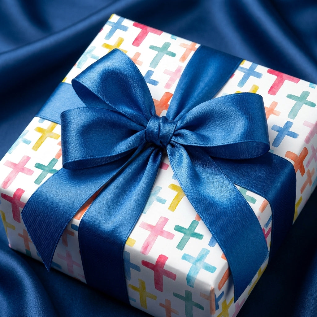Watercolor cross baptism wrapping paper with blue satin bow on gift box, by Wrapped Studios.