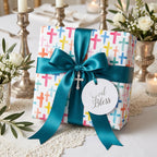 Baptism wrapping paper with colorful watercolor crosses and a teal ribbon by Wrapped Studios.