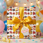 Birthday wrapping paper from Wrapped Studios featuring a cake pattern and gold ribbon.