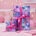 Two gifts wrapped in purple rain-themed birthday wrapping paper with bright pink satin ribbon.