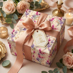 Elegant floral wedding gift wrapped in luxury floral wrapping paper with a peach satin ribbon.