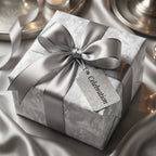 Luxury silver floral wrapping paper with a satin bow and celebration tag by Wrapped Studios.