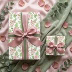 Luxury pink floral wrapping paper with dusty rose and sage green velvet bows by Wrapped Studios.