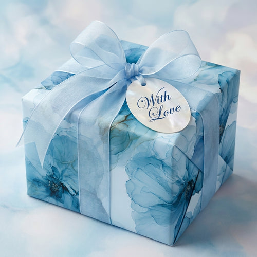 Luxury blue floral wrapping paper with sheer ribbon and "With Love" tag, Wrapped Studios.