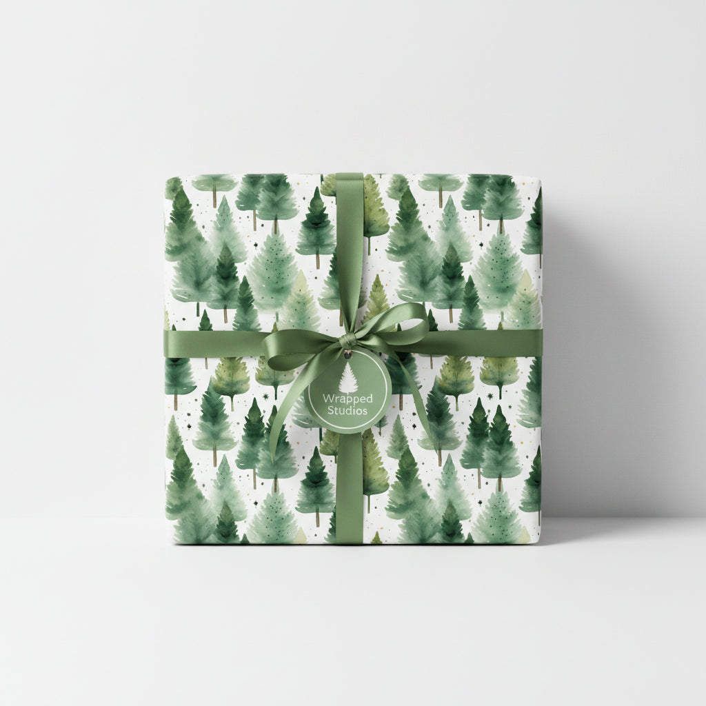 Elegant Christmas gift wrap featuring watercolor pine tree pattern with green ribbon.