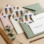 Watercolor graduation envelope liners in sage green and blush pink by Wrapped Studios.