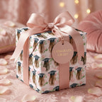 Pink graduation wrapping paper with watercolor graduate pattern and satin ribbon bow by Wrapped Studios.