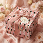 Elegant pink graduation wrapping paper with a velvet bow and Dream Big tag, by Wrapped Studios.