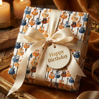 Electric guitar music wrapping paper with a cream satin bow and birthday tag by Wrapped Studios.