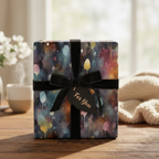 Gift wrapped in watercolor balloon pattern paper with black velvet ribbon and "For You" tag.