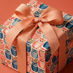 Cute owl wrapping paper for birthday or baby shower gifts with a peach ribbon bow by Wrapped Studios.