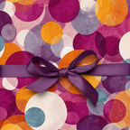 Gift wrapped in modern geometric wrapping paper with a purple satin bow, perfect for birthday celebrations.