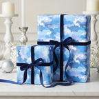 Blue watercolor wrapping paper with navy velvet ribbon on gifts for Christmas or birthday.
