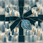 Elegant gift box wrapped in winter forest wrapping paper with a teal velvet ribbon and leaf-shaped tag.