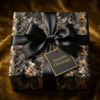 Elegant Christmas gift wrap with a black ribbon and tag.