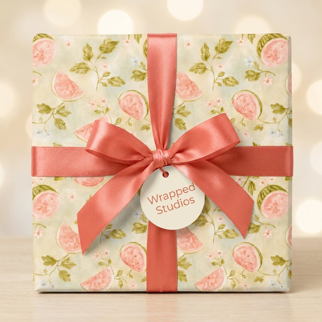 Watercolor watermelon wrapping paper with coral ribbon and gift tag by Wrapped Studios.