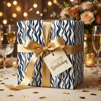 Navy wave birthday wrapping paper with gold ribbon, by Wrapped Studios.