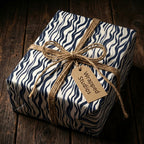 Navy and white wavy stripe wrapping paper with twine bow from Wrapped Studios.