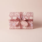 Elegant gift with mauve floral wrapping paper, ribbon, and "A Gift for You" tag.