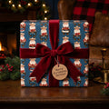 Blue cowboy Santa Christmas wrapping paper with a red velvet bow by Wrapped Studios.