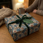 Elegant Christmas wrapping paper with vintage pine wreath pattern and green velvet ribbon by Wrapped Studios.