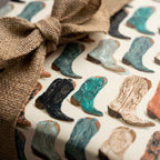 Teal and cream western cowboy boot wrapping paper with a rustic burlap bow by Wrapped Studios.