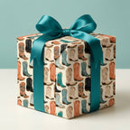 Cowboy boot wrapping paper with teal satin bow, rustic western gift wrap by Wrapped Studios.
