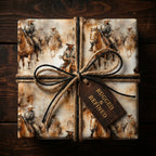 Square gift wrapped in vintage-style cowboy wrapping paper with twine and a leather tag.