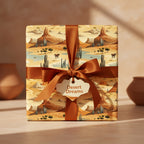 Gift box wrapped in desert-themed wrapping paper with a satin ribbon and a "Desert Dreams" tag.