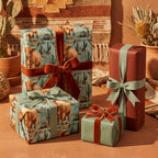 Rustic highland cow wrapping paper and western gift wrap with velvet ribbons by Wrapped Studios.