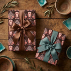 Rustic boho steer skull gift wrap with satin ribbons on a wood background by Wrapped Studios.